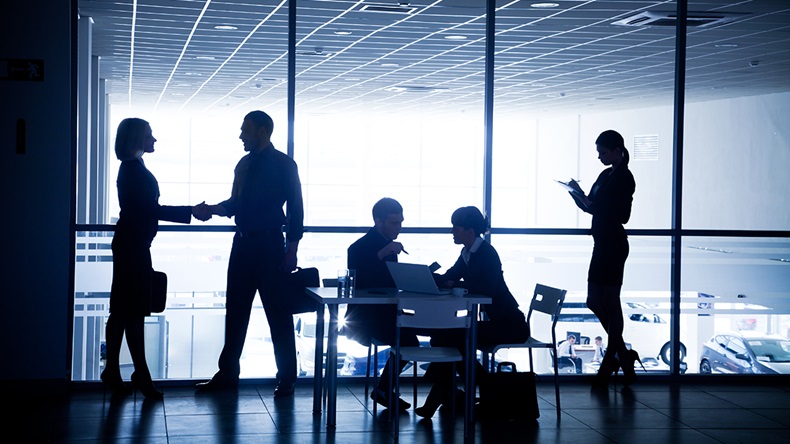 Business silhouettes (YanLev/Shutterstock.com)